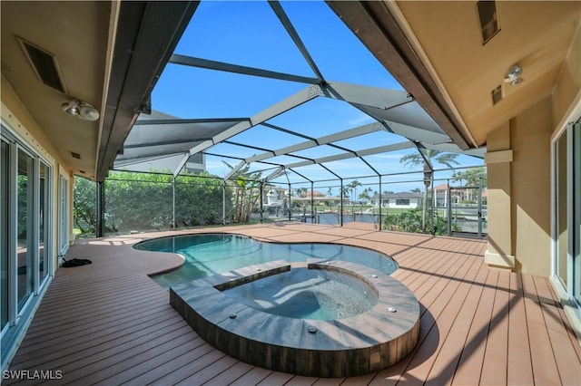 view of swimming pool with a lanai and a pool with connected hot tub