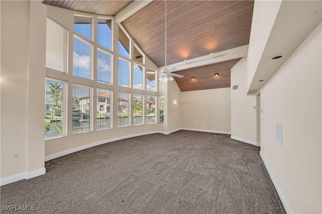 unfurnished living room featuring ceiling fan, wooden ceiling, baseboards, and carpet floors