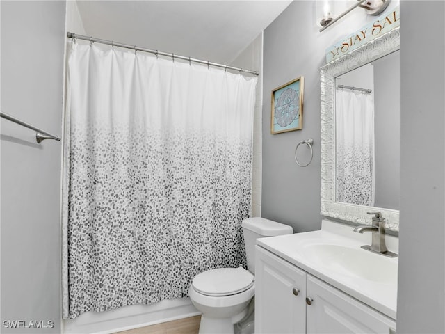 full bathroom featuring toilet and vanity