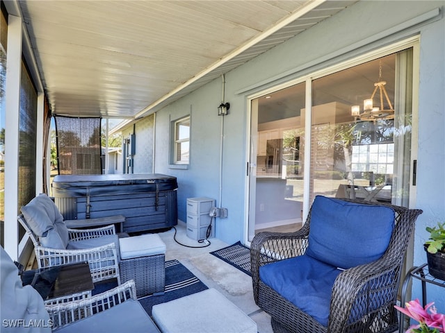 view of patio with a hot tub