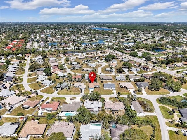 aerial view with a residential view and a water view