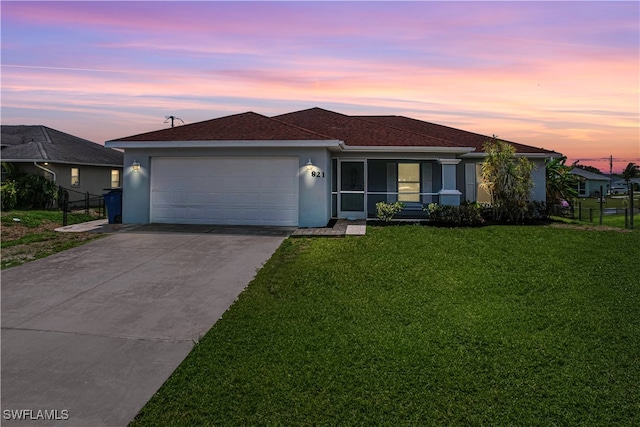 821 Casino Ave, Lehigh Acres, FL 33971 - view of front of property with stucco siding, a garage, concrete driveway, and a shingled roof