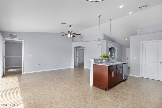 821 Casino Ave, Lehigh Acres, FL 33971 - kitchen featuring a sink, arched walkways, a ceiling fan, vaulted ceiling, and light tile patterned floors