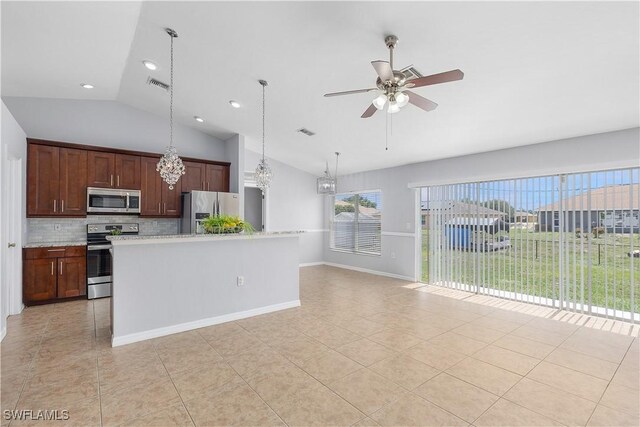 821 Casino Ave, Lehigh Acres, FL 33971 - kitchen featuring appliances with stainless steel finishes, vaulted ceiling, light tile patterned floors, tasteful backsplash, and ceiling fan