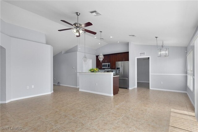 821 Casino Ave, Lehigh Acres, FL 33971 - unfurnished living room with a ceiling fan, a chandelier, lofted ceiling, light tile patterned floors, and recessed lighting