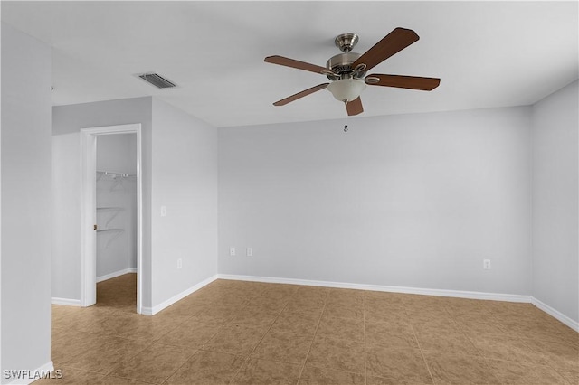 821 Casino Ave, Lehigh Acres, FL 33971 - tiled spare room featuring a ceiling fan and baseboards