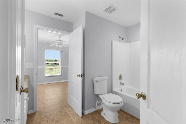 821 Casino Ave, Lehigh Acres, FL 33971 - full bathroom with toilet, tile patterned floors, bathtub / shower combination, a ceiling fan, and baseboards