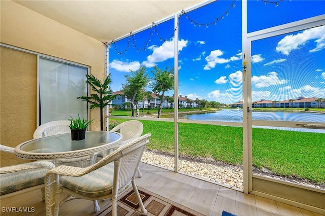 sunroom with a water view