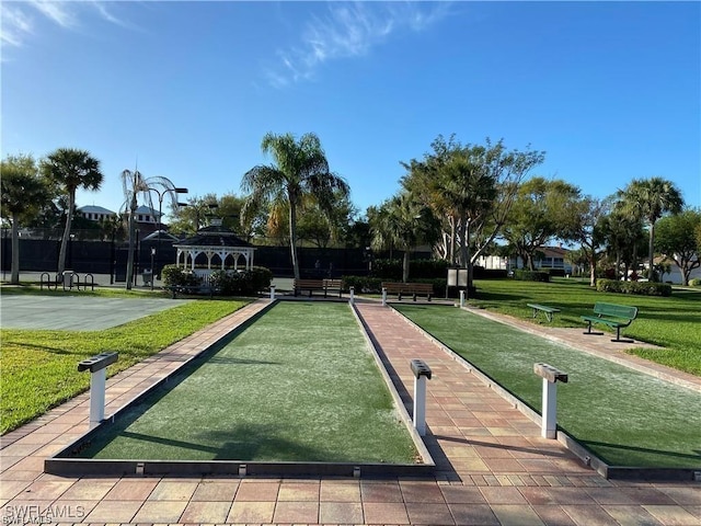 surrounding community with a gazebo and a lawn