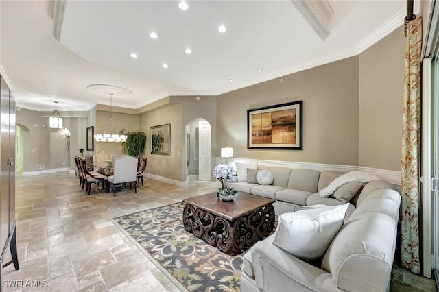 9293 Menaggio Ct Unit 102, Naples, FL 34114 - living room with crown molding, stone tile floors, baseboards, and arched walkways
