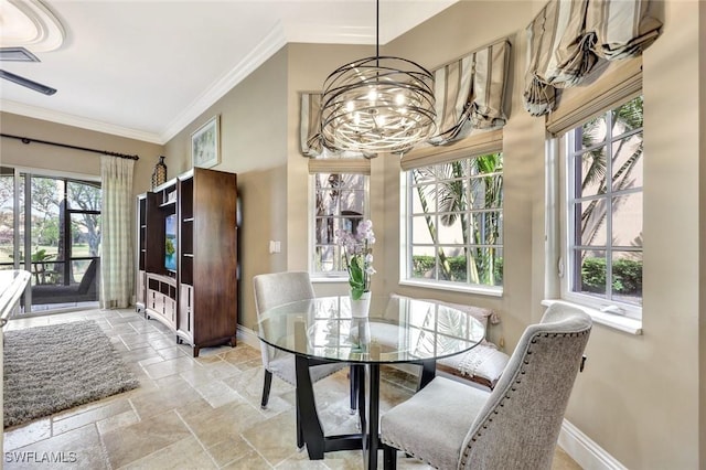 9293 Menaggio Ct Unit 102, Naples, FL 34114 - dining area featuring baseboards, stone tile floors, crown molding, and an inviting chandelier