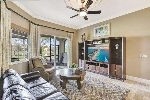 9293 Menaggio Ct Unit 102, Naples, FL 34114 - living room with stone tile flooring, a ceiling fan, baseboards, and ornamental molding