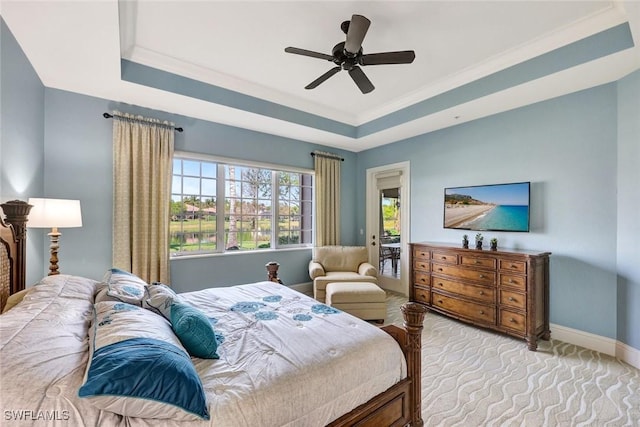 9293 Menaggio Ct Unit 102, Naples, FL 34114 - bedroom featuring a tray ceiling, baseboards, light colored carpet, and ceiling fan