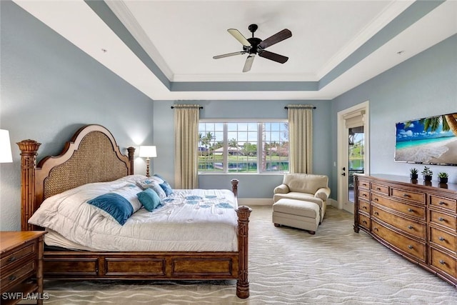 9293 Menaggio Ct Unit 102, Naples, FL 34114 - bedroom with ornamental molding, a tray ceiling, baseboards, light colored carpet, and ceiling fan