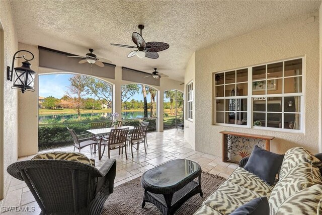 9293 Menaggio Ct Unit 102, Naples, FL 34114 - view of patio / terrace featuring outdoor dining space, a ceiling fan, and outdoor lounge area