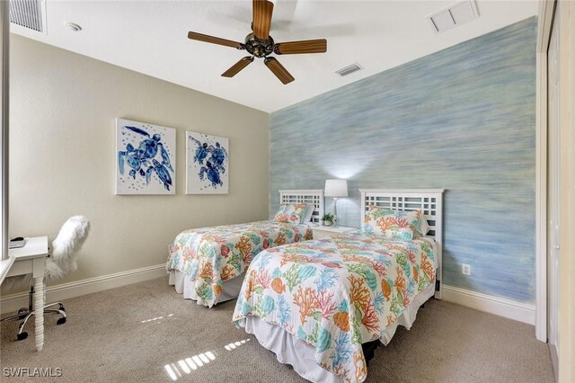 9293 Menaggio Ct Unit 102, Naples, FL 34114 - carpeted bedroom with visible vents, baseboards, an accent wall, and wallpapered walls