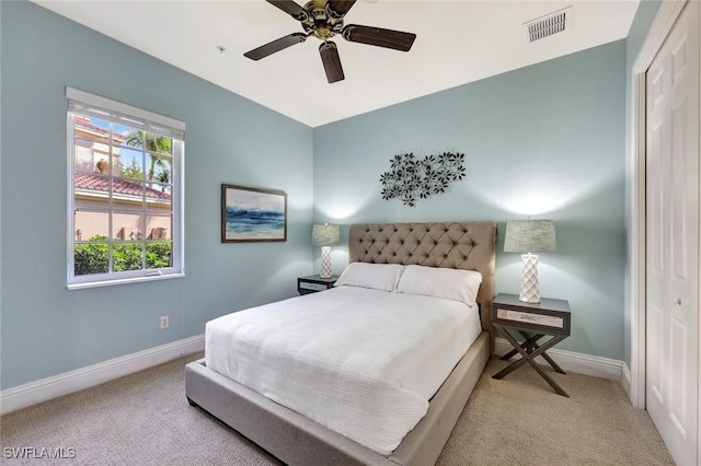 9293 Menaggio Ct Unit 102, Naples, FL 34114 - carpeted bedroom featuring visible vents, baseboards, a closet, and a ceiling fan