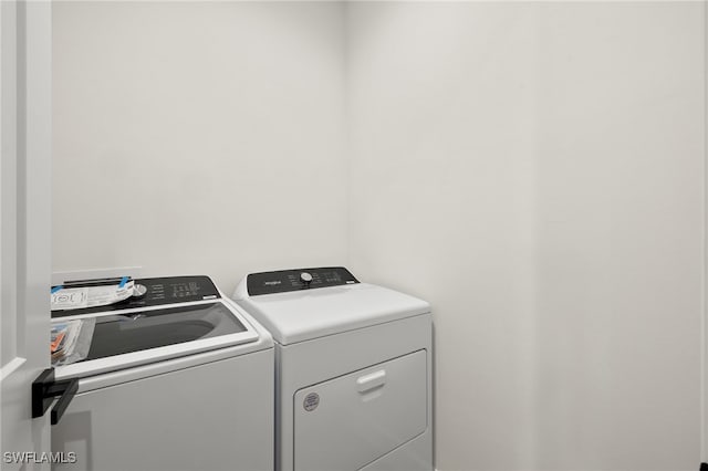 laundry area featuring laundry area and washer and clothes dryer