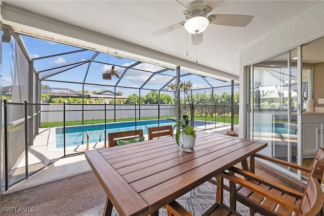 view of patio / terrace with a fenced in pool, outdoor dining area, a lanai, and a ceiling fan