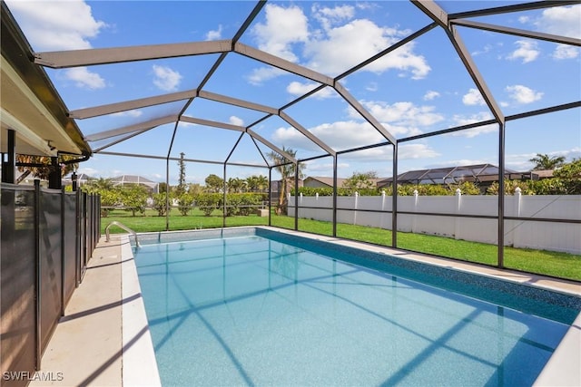 view of pool featuring a lanai, a lawn, a fenced in pool, and fence