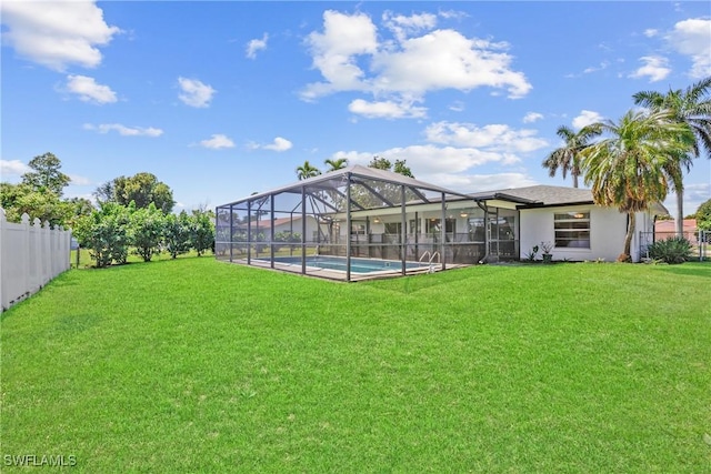 view of yard featuring glass enclosure, a fenced in pool, and fence