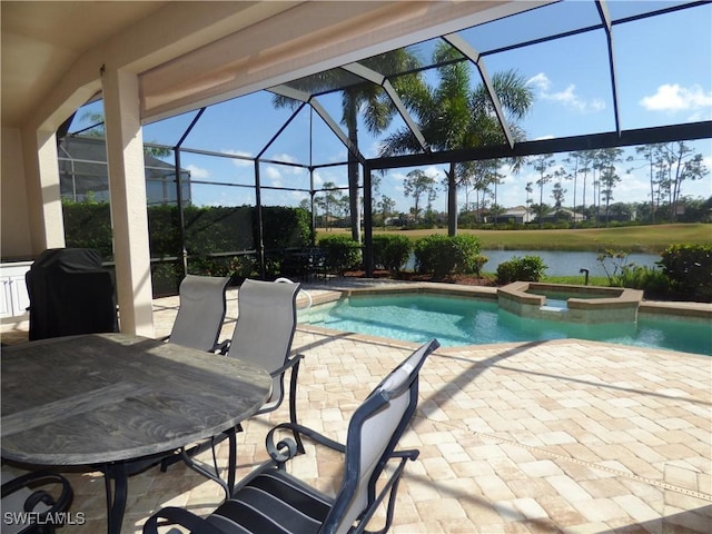 view of pool featuring a lanai, a patio area, a water view, and a pool with connected hot tub