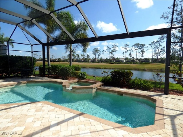 view of pool with a patio, a water view, a pool with connected hot tub, and a lanai