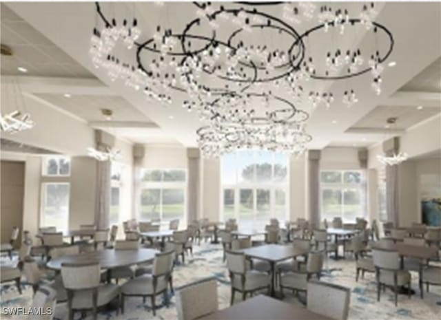 dining room featuring a notable chandelier, plenty of natural light, and coffered ceiling