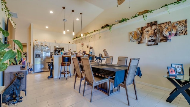 dining area with light tile patterned floors, baseboards, vaulted ceiling, and recessed lighting