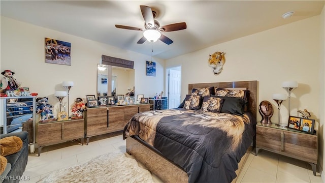 tiled bedroom with ceiling fan
