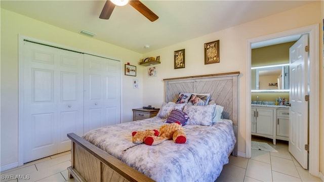 bedroom with a ceiling fan, visible vents, a closet, and light tile patterned floors