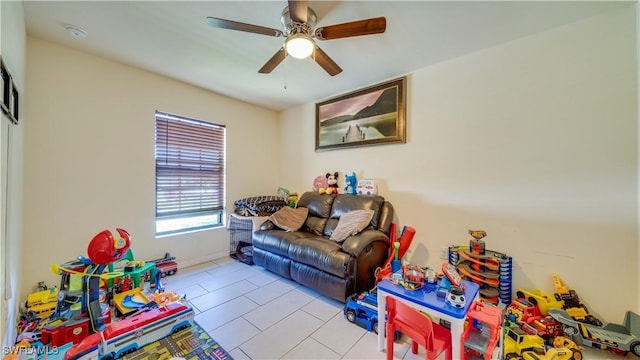 game room with tile patterned floors and a ceiling fan