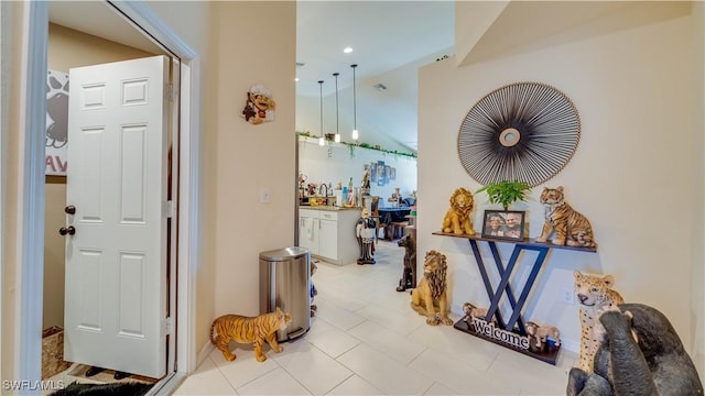 hall featuring a sink, recessed lighting, and visible vents