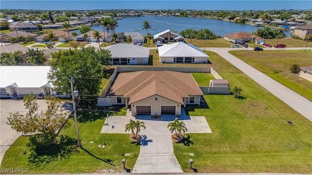 aerial view with a residential view and a water view