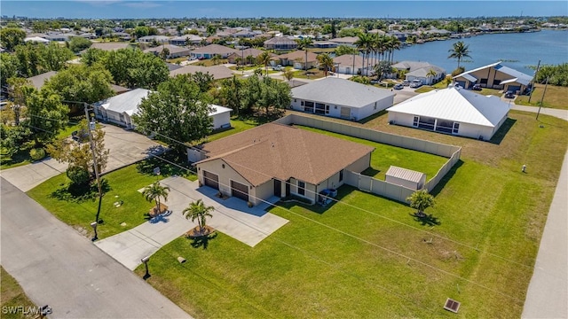 bird's eye view with a residential view and a water view