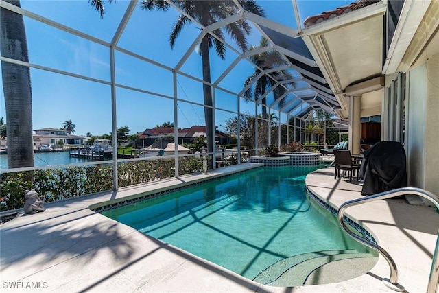 view of swimming pool with a lanai, a patio area, a water view, and a pool with connected hot tub