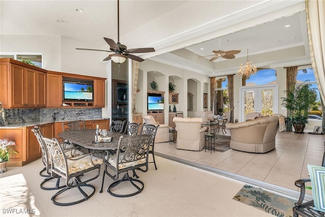 view of patio / terrace with outdoor dining space, an outdoor kitchen, and a ceiling fan