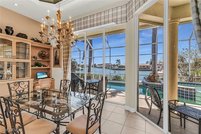 dining room featuring light tile patterned flooring, plenty of natural light, and a chandelier