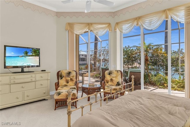 bedroom with multiple windows, light carpet, and ornamental molding