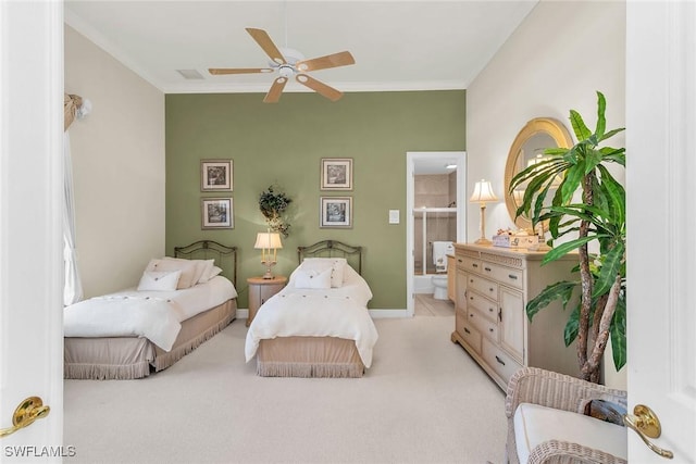 bedroom with a ceiling fan, baseboards, ensuite bath, crown molding, and light colored carpet