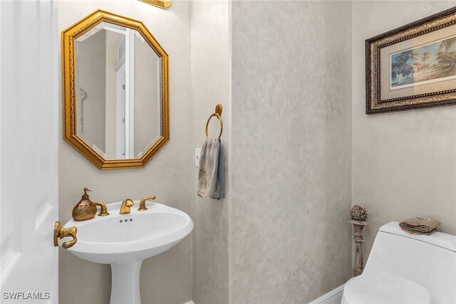 bathroom featuring toilet