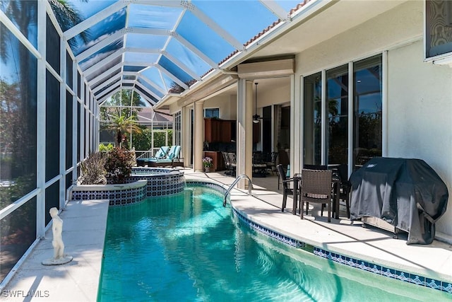 outdoor pool featuring a lanai, a grill, and a patio