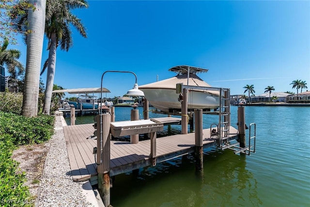 dock area featuring a water view and boat lift