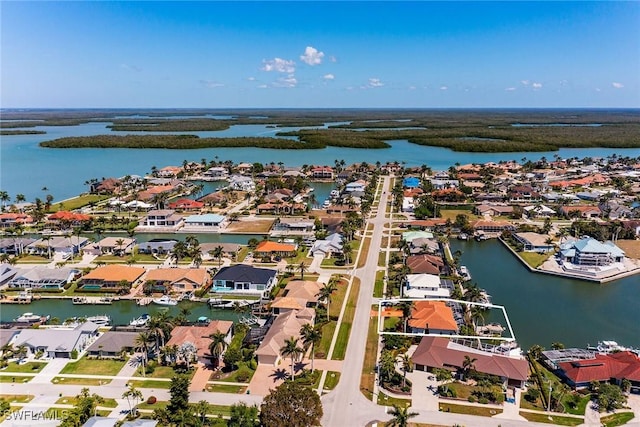 birds eye view of property featuring a residential view and a water view