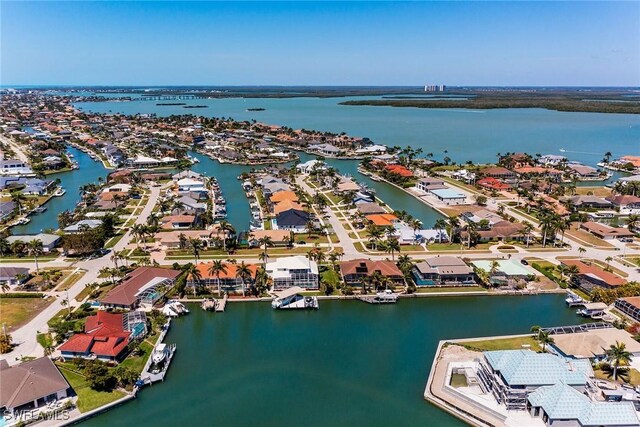 drone / aerial view featuring a residential view and a water view