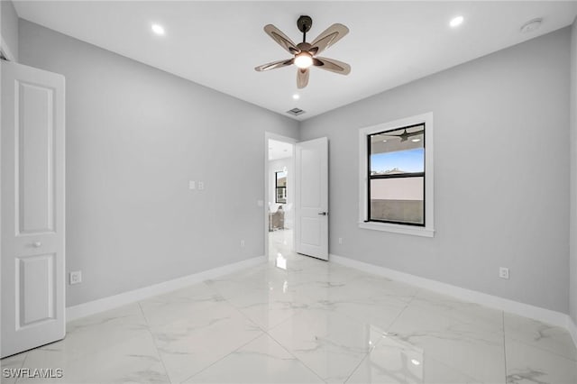 unfurnished room featuring recessed lighting, marble finish floor, baseboards, and ceiling fan