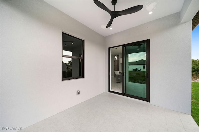 view of patio / terrace featuring ceiling fan