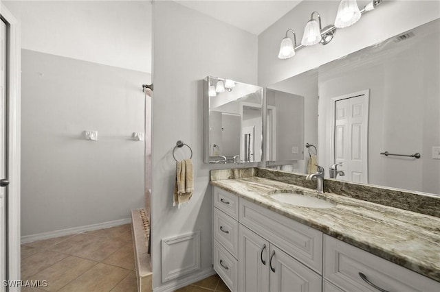 2218 NE 5th Ter, Cape Coral, FL 33909 - full bathroom featuring tile patterned flooring, vanity, baseboards, and visible vents