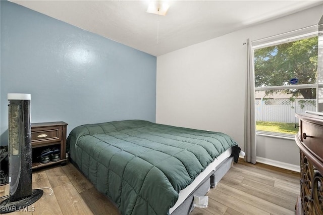 2218 NE 5th Ter, Cape Coral, FL 33909 - bedroom with baseboards and wood finished floors