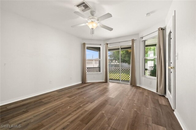 2218 NE 5th Ter, Cape Coral, FL 33909 - spare room with dark wood-style flooring, visible vents, baseboards, and ceiling fan